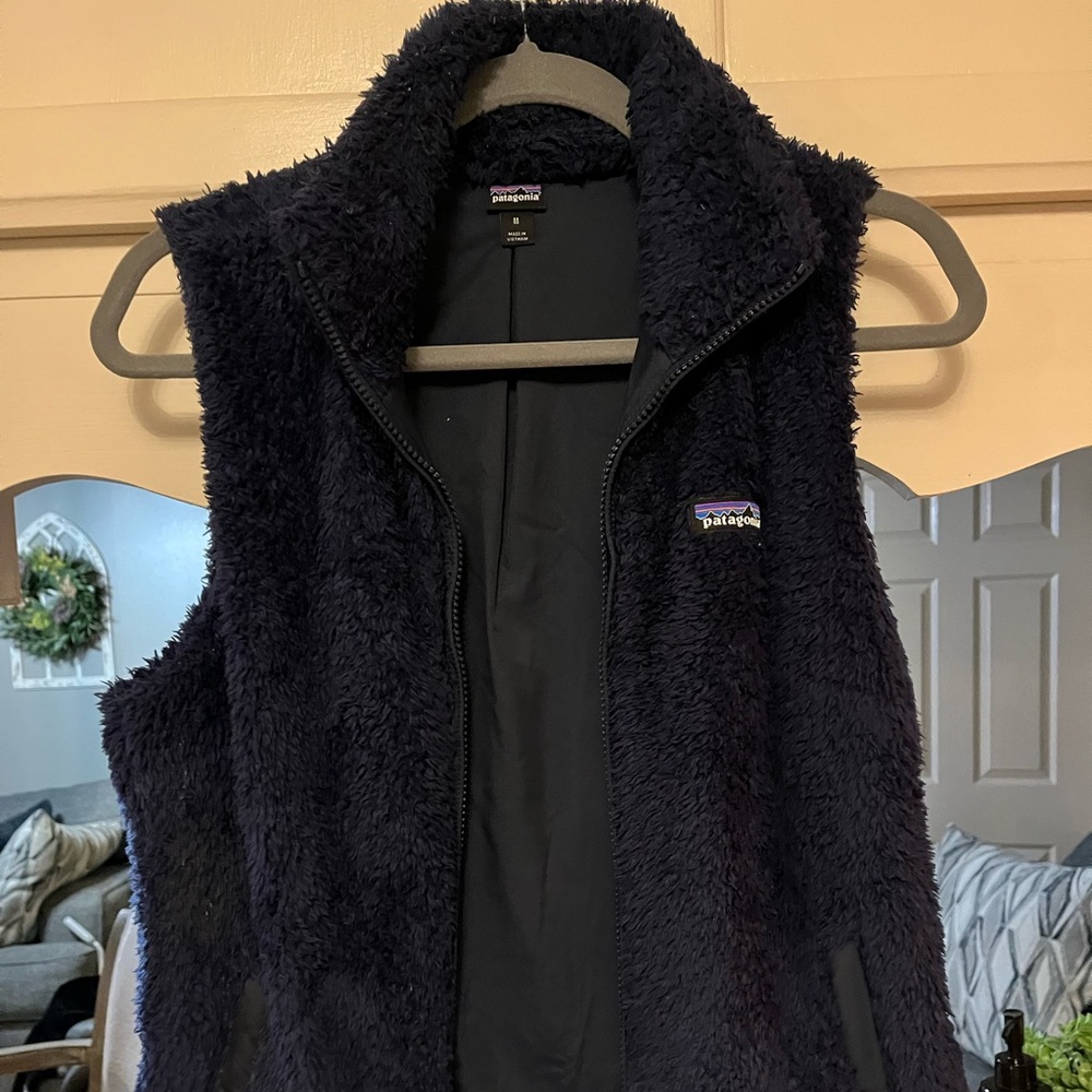 Patagonia vest navy wore once 
Size medium